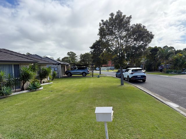 A neat front-yard lawn and streetscape